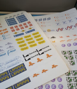 Sticker sheets with colourful logos of many academic software packages